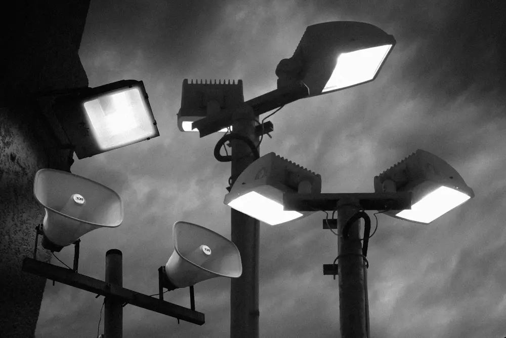A collage of lights poles and a megaphone